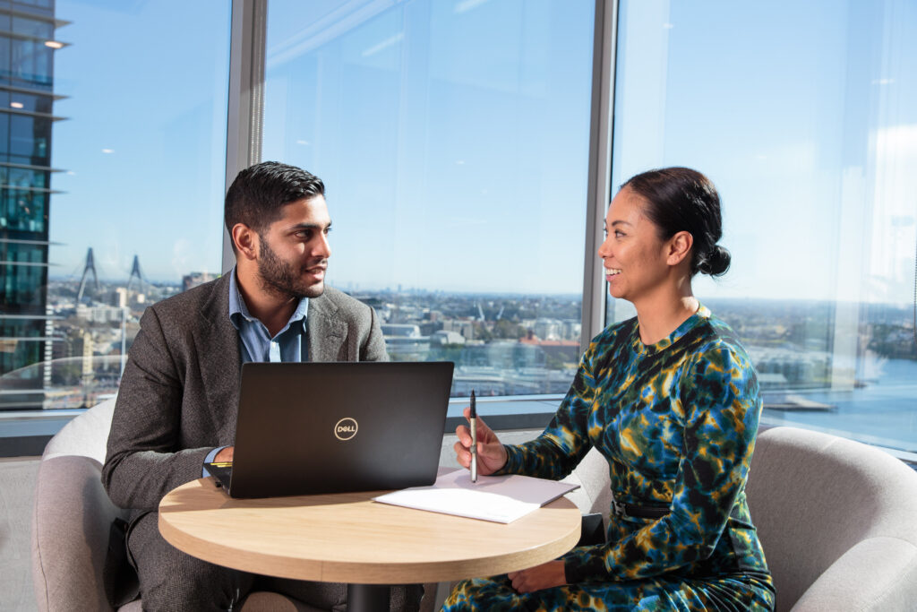 home page image, sydney advisors chatting in front of window
